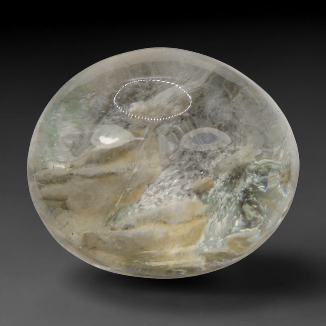 15ct Natural Brazilian Phantom Quartz Oval Cabochon Loose Gemstone, 15BP: This smoothly polished cabochon of natural phantom quartz preserves delicate layered phantom crystal formations enclosed inside transparent quartz host. The domed polished surface offers unobstructed 