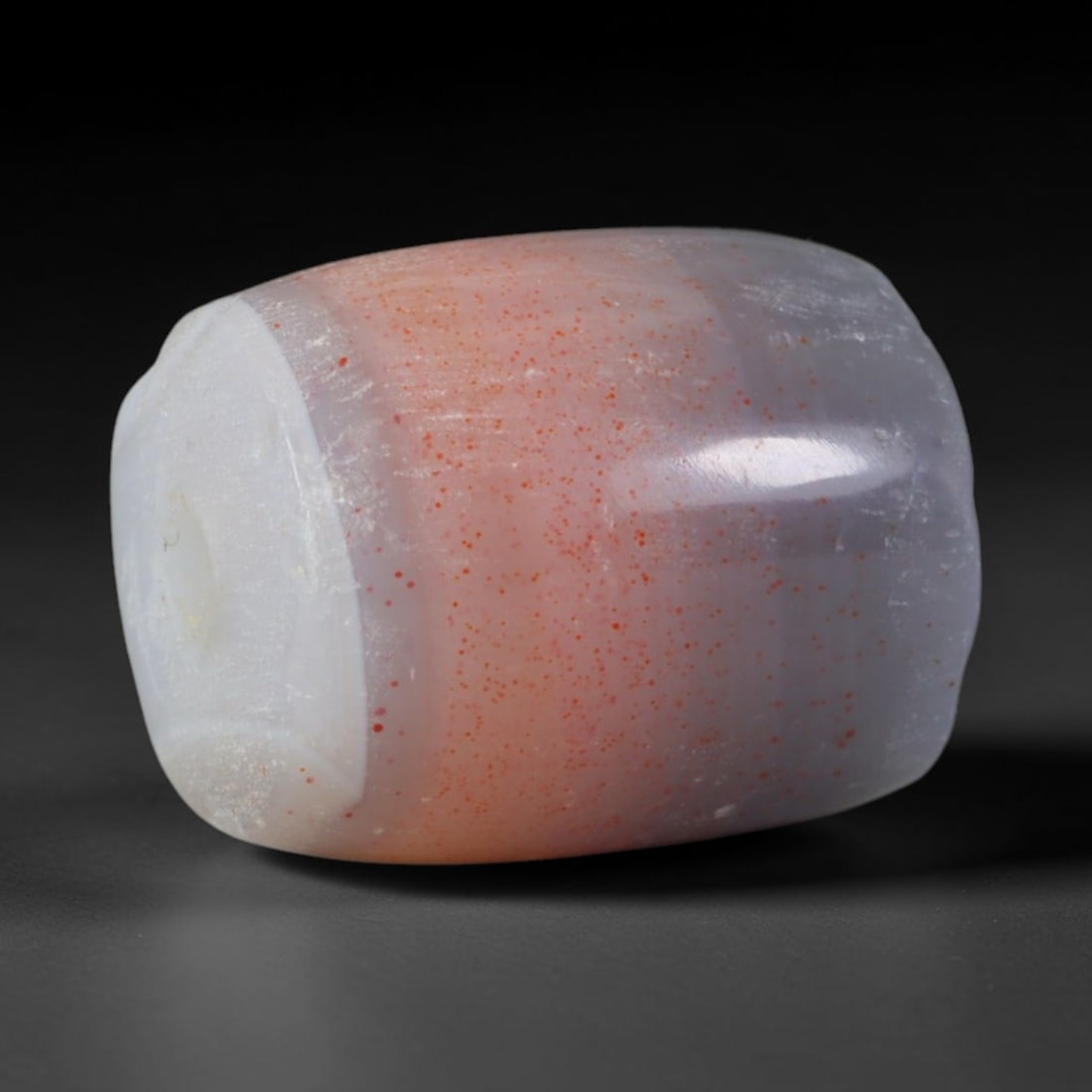 Ancient Medieval Seljuk Persian Culture Banded Agate Barrel Bead (1037-1307 CE), 32AD: This antique banded agate barrel bead originates from Seljuk Persian Culture, medieval Iranian artisans famed for mass crafting polished agate rosary beads and decorative spacer beads for noble elite 