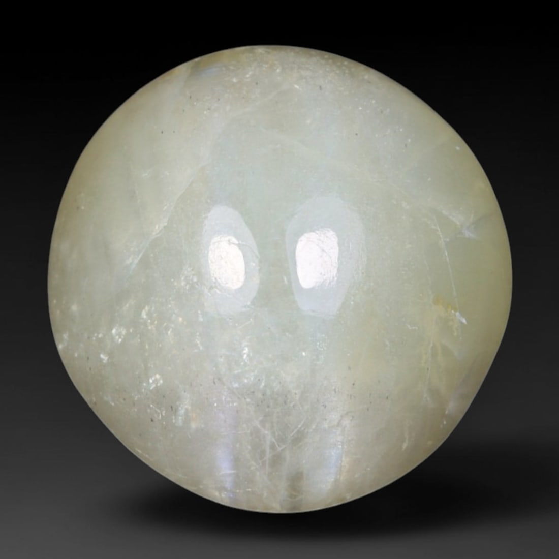 1.78 Carats Natural Ceylon Chrysoberyl Cat's Eye Loose Gemstone, 11AL: This polished Ceylon chrysoberyl cabochon displays a sharp, distinct silvery chatoyant band running across its smooth surface, formed by dense aligned microscopic rutile inclusions inherent to genuine