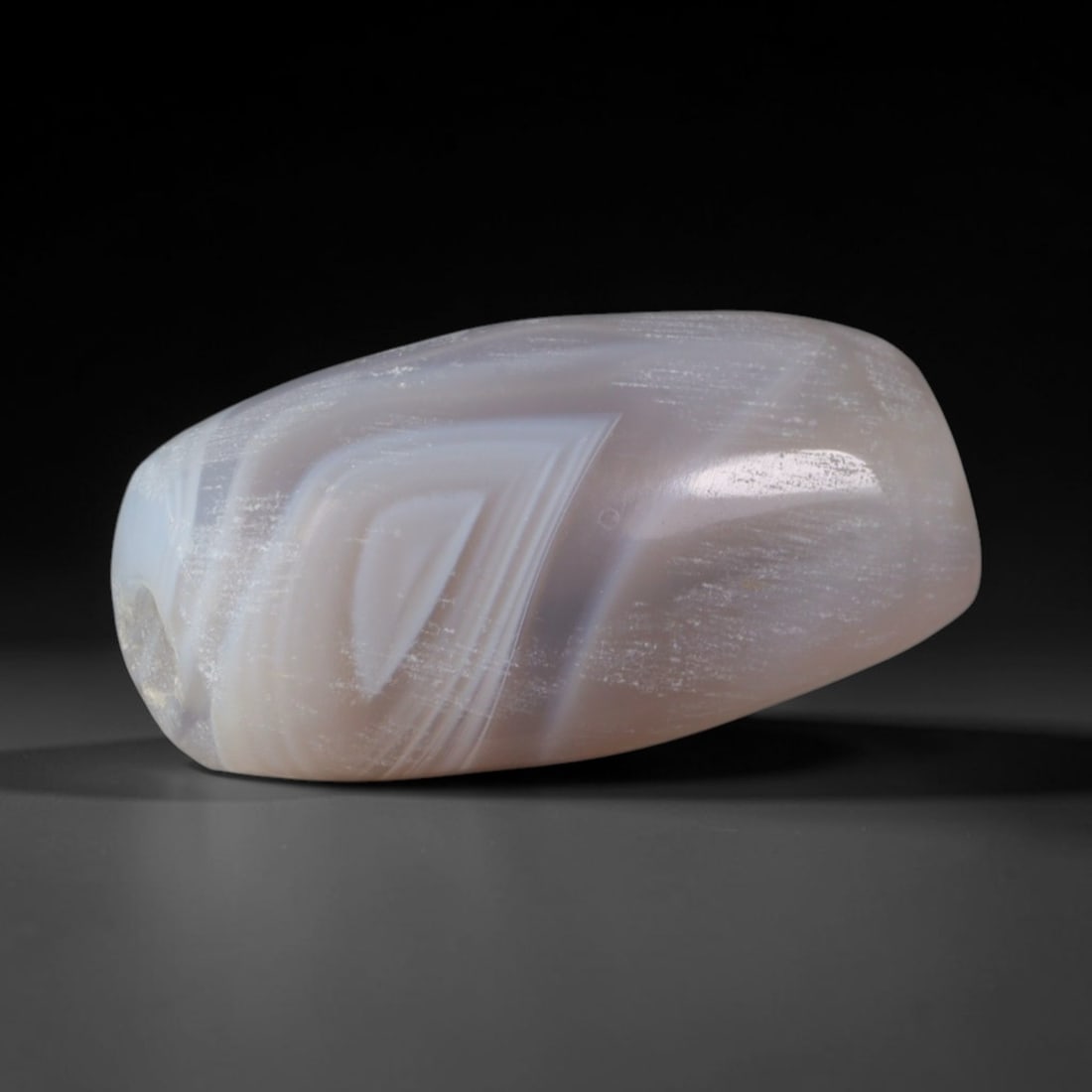 Ancient Elamite Civilization Banded Agate Barrel Bead (2700-539 BCE), 36AD: This antique banded agate barrel bead originates from the Elamite Civilization, an ancient Iranian plateau culture celebrated for refined agate lapidary traditions that supplied ritual beads and elite