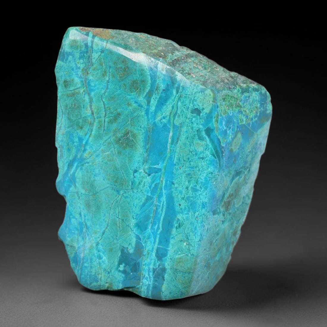 142.81ct Natural Peruvian Chrysocolla Polished Slab Rough, 63EK: This partial-polished chrysocolla slab features blended mineral matrix with smooth refined face and unaltered natural rugged edge across its 38x27x17mm elongated form, translucent mineral layers hold 