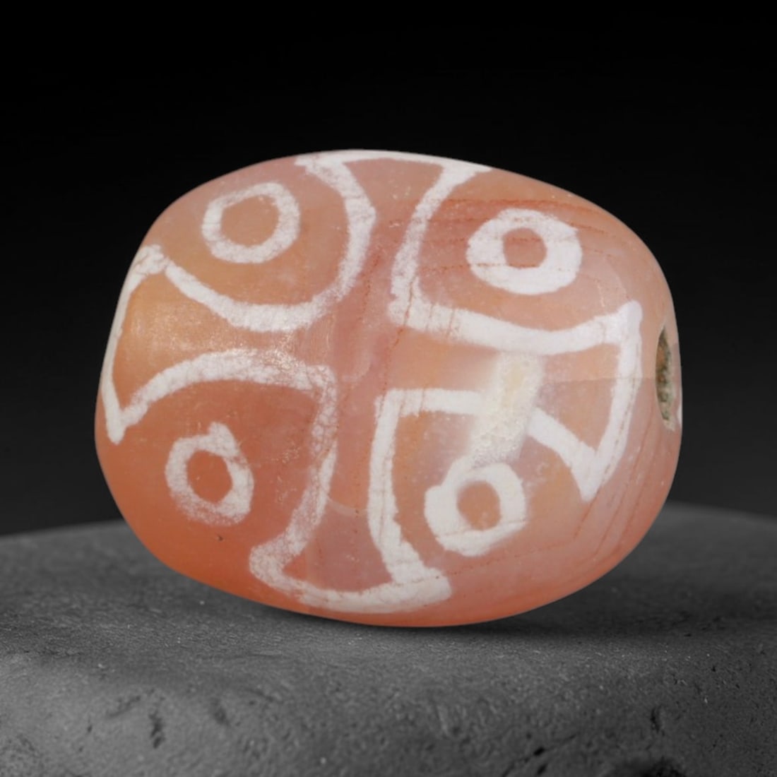 Antique Sino-Himalayan Region Etched Carnelian Bead, 10EH: Antique etched carnelian bead originating from the Sino-Himalayan region. Exhibits characteristic surface patina and traditional etched white decoration. Dimensions: 13x11mm, fully pierced for suspens