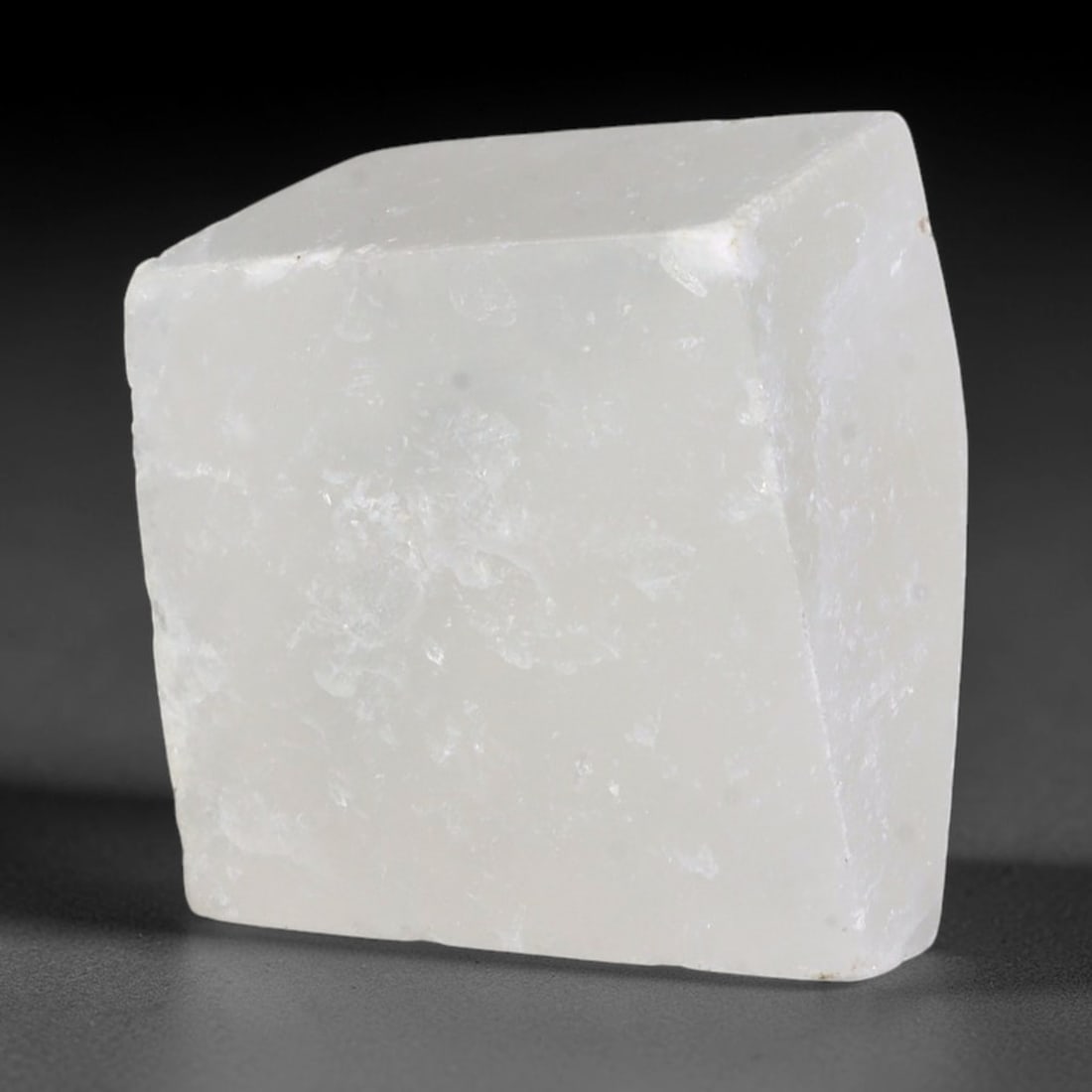 60ct Natural Moroccan Transparent White Selenite Rough Block, 80AH: This solid selenite rough block features milky translucent white body marked by distinct parallel internal striations that catch soft diffused light across its naturally faceted raw planes, faint pale