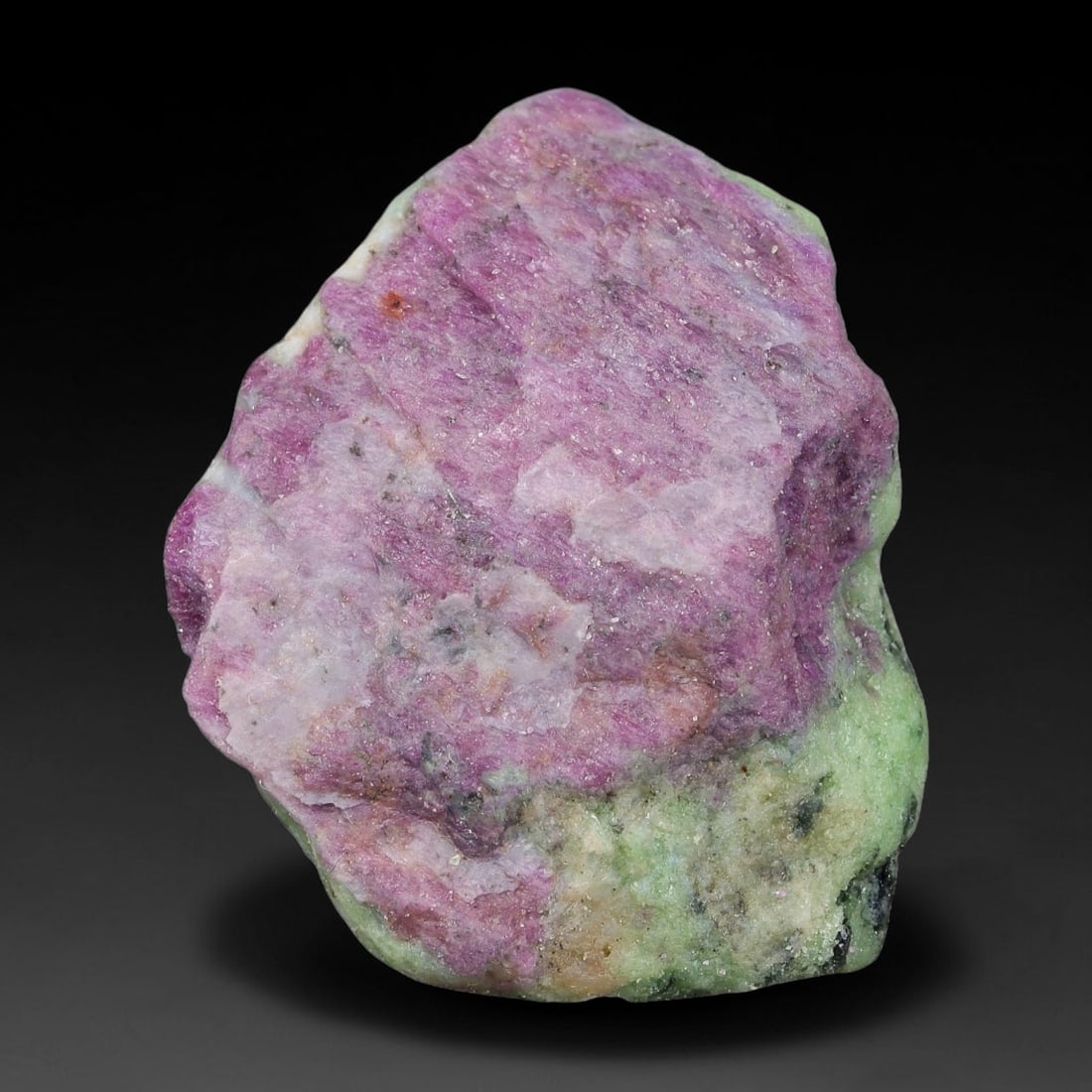 108ct Natural Tanzanian Ruby Zoisite Raw Rough Specimen Mineral Stone, 3FC: This unpolished mineral rough is natural ruby zoisite sourced from Tanzania, exhibiting distinct banded mineral segregation of vibrant green zoisite, magenta ruby crystals, and dark hornblende inclusi