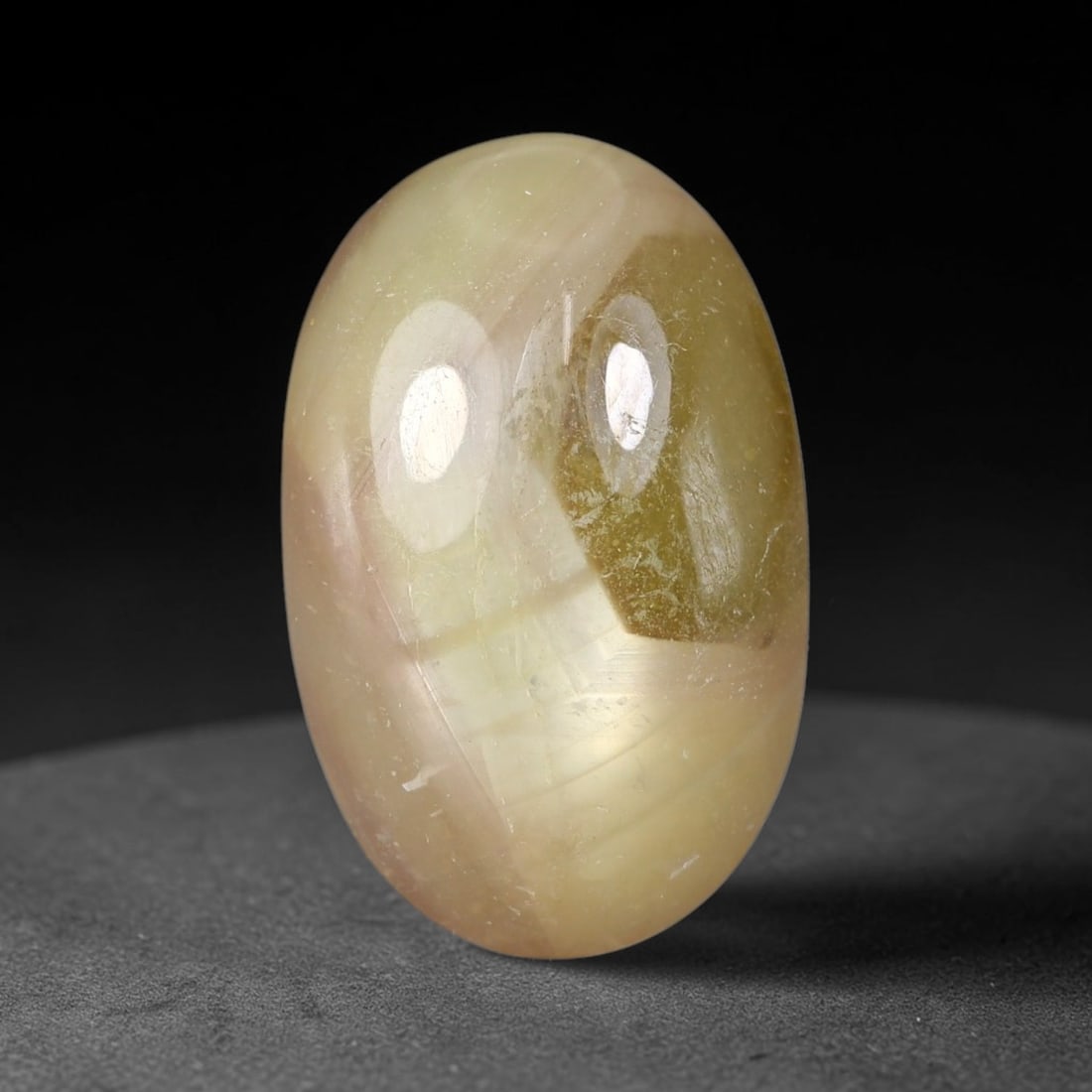 13.95 Carats Natural Madagascar Soft Rose Pink Heated Ruby Cabochon Loose Gemstone, 59FE: This warm blush-toned ruby cabochon carries blended swathes of soft rose pink and gentle peach undertones, with faint natural mineral veining throughout the polished dome, measured at 17.7x11.3x6.6mm.