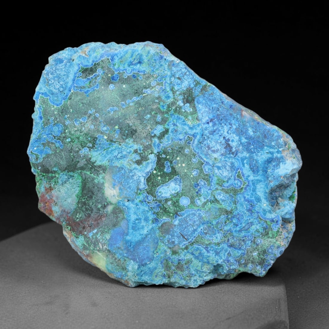 229.54ct Natural Peruvian Chrysocolla Polished Slab Rough, 64EK: This partial-polished chrysocolla slab features blended mineral matrix with smooth refined face and unaltered natural rugged edge across its 61x46x8mm elongated form, translucent mineral layers hold s