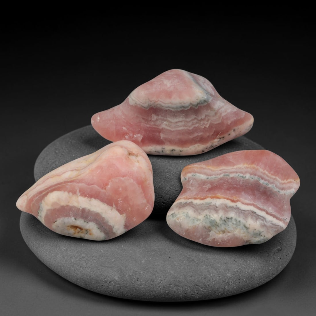 58ct 3pcs Natural Argentine Rhodochrosite Banded Tumbled Rough Set, 11FD: This listing features three individual tumbled rhodochrosite rough pieces sourced from Argentina Capillitas deposits, each showcasing distinct layered banding of soft rose pink, cream white and pale t