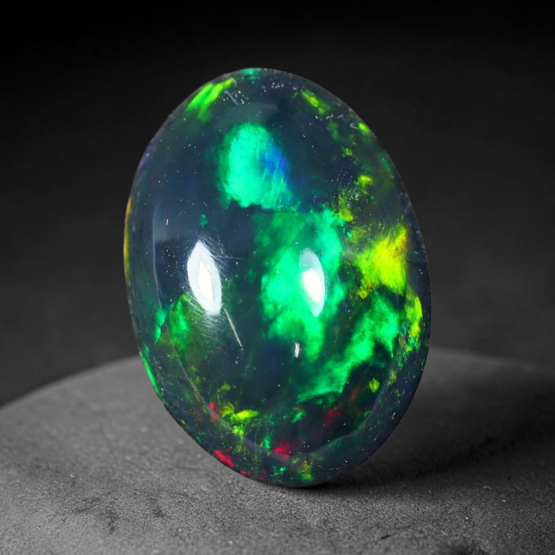 2.26ct Natural Ethiopian Welo Black Smoked Opal Cabochon Loose Gemstone, 79FX: This fully polished Ethiopian Welo opal features a dark smoked base with vivid, sweeping play-of-color shifting across its glossy dome surface, measured at 12x8x4mm. The black smoke treatment deepens 
