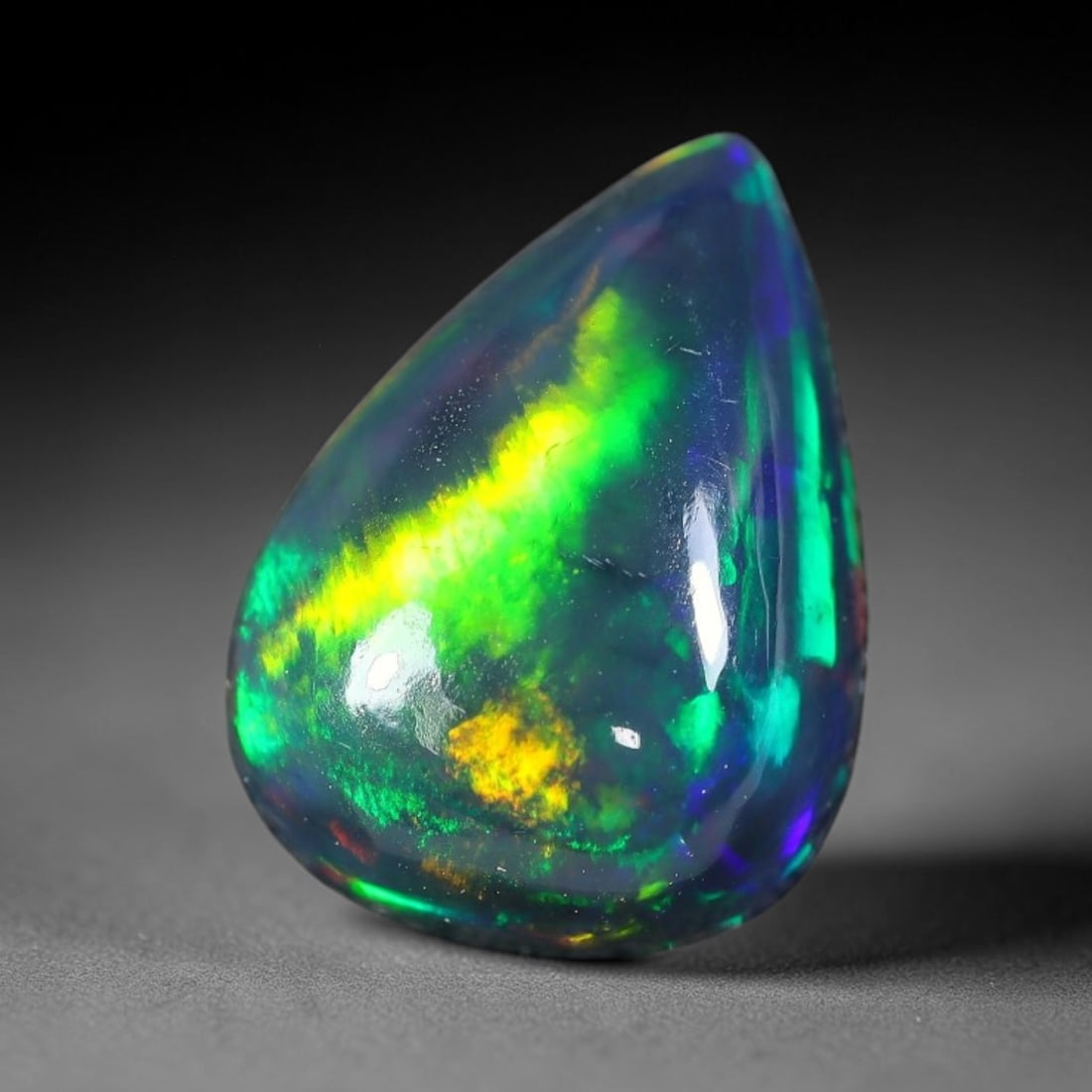 3.13ct Natural Ethiopian Welo Black Smoked Opal Cabochon Loose Gemstone, 34FX: This fully polished Ethiopian Welo opal features a dark smoked base with vivid, sweeping play-of-color shifting across its glossy dome surface, measured at 12x9x6mm. The black smoke treatment deepens 