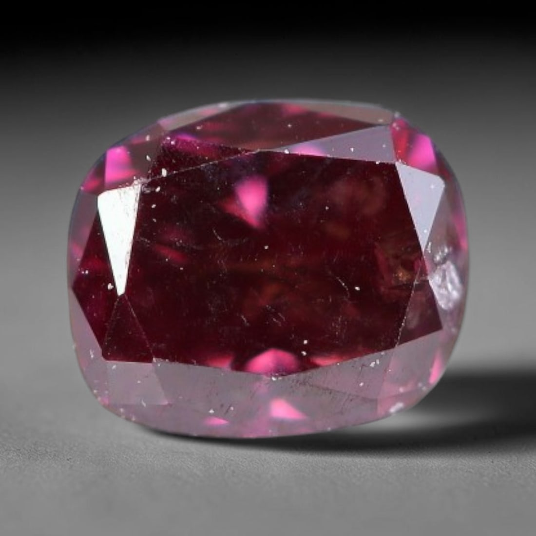 0.19ct Natural Fancy Pinkish Purple Diamond Loose Gemstone, 12BH: This polished natural diamond displays rich pinkish-purple body saturation, with subtle fine microscopic mineral specks distributed within its crystal interior, measured at calibrated dimensions of 3.
