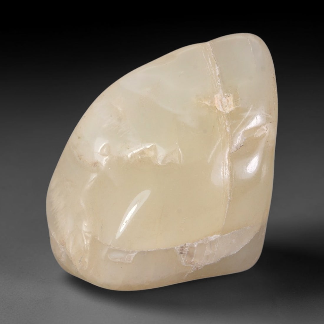 83ct Natural Ceylon Pale Cream White Moonstone Rough, 74AH: This smooth weathered moonstone rough carries soft pale cream white translucency with subtle internal silvery adularescent shimmer locked within its naturally tumbled surface, fine faint mineral veini