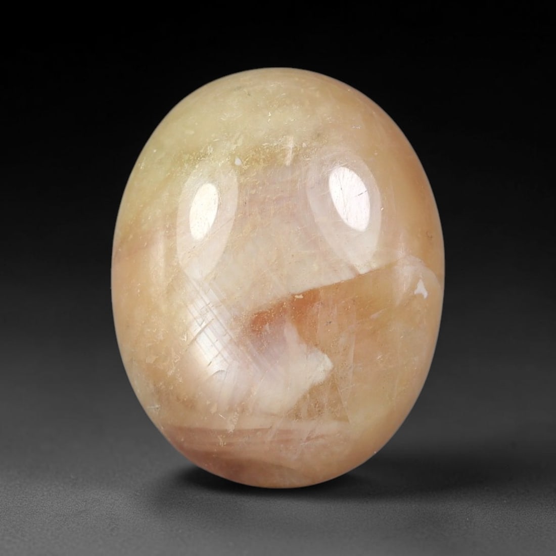 14.97 Carats Natural Madagascar Soft Rose Pink Heated Ruby Cabochon Loose Gemstone, 60FE: This warm blush-toned ruby cabochon carries blended swathes of soft rose pink and gentle peach undertones, with faint natural mineral veining throughout the polished dome, measured at 16.2x13x6.2mm. T