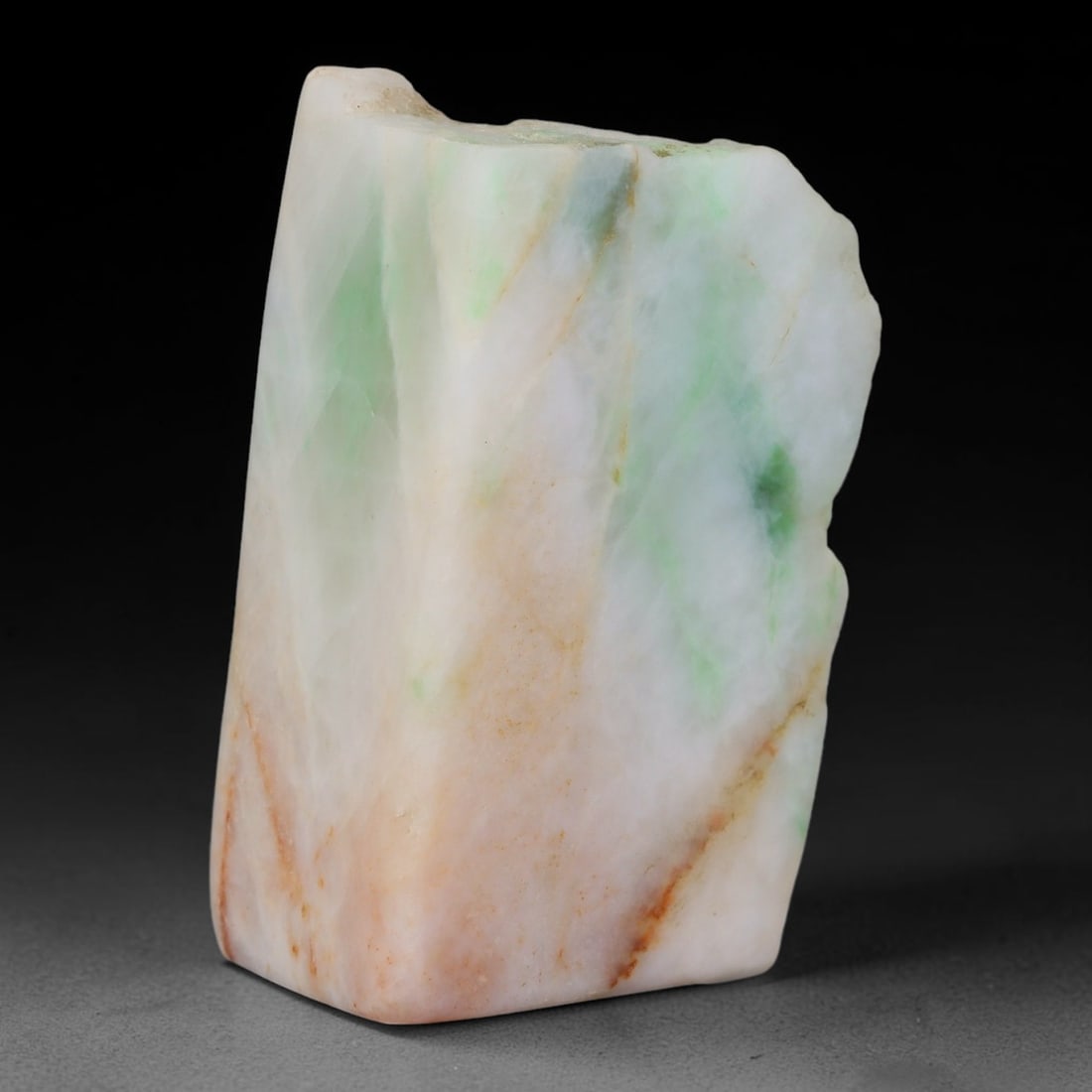 320ct Natural Type A Burmese Jadeite Jade Sliced Rough, 3FB: This specimen is a sliced rough block of natural Type A Burmese jadeite jade. The interior displays natural colour zoning with visible mineral veining and crystalline patterns typical of unprocessed j