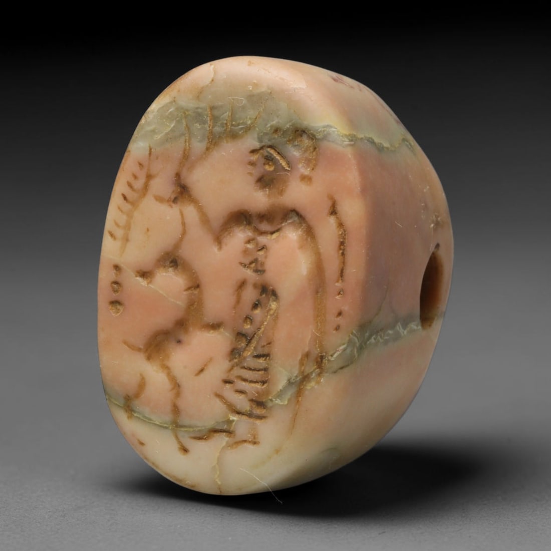 Ancient Sasanian Persian Conoid Stone Stamp Seal (224-651 CE), 63ED: This antique conoid stamp seal originates from the Sasanian Persian Empire, employed as a functional marking tool and wearable personal talisman in late antiquity. The pink mottled stone features an e