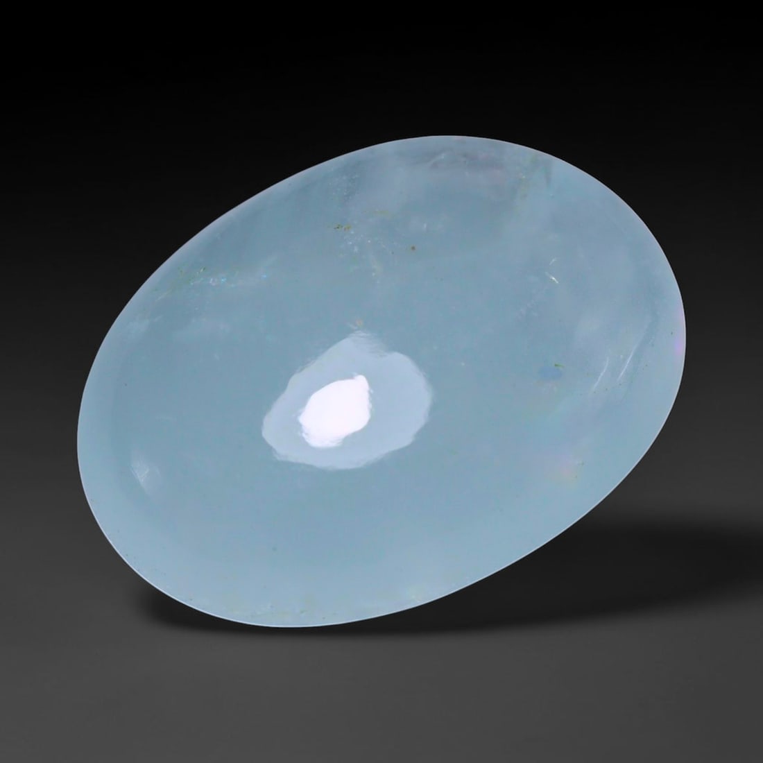 21.31ct Natural Nigerian Aquamarine Oval Cabochon Loose Gemstone, 67BY: This elegantly polished oval cabochon is natural aquamarine sourced from Nigeria. It features soft tranquil pale blue colour with subtle even tone distribution throughout the translucent crystal. The 