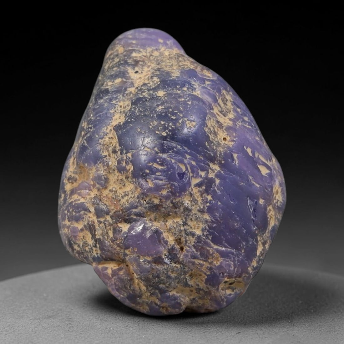 35.90ct Natural Unheated Sri Lankan Purplish Blue Sapphire Rough, 98FC: This natural corundum rough is an unheated purplish blue sapphire sourced from Sri Lankan alluvial gem deposits, featuring an irregular natural native form with residual pale yellow-brown mineral matr