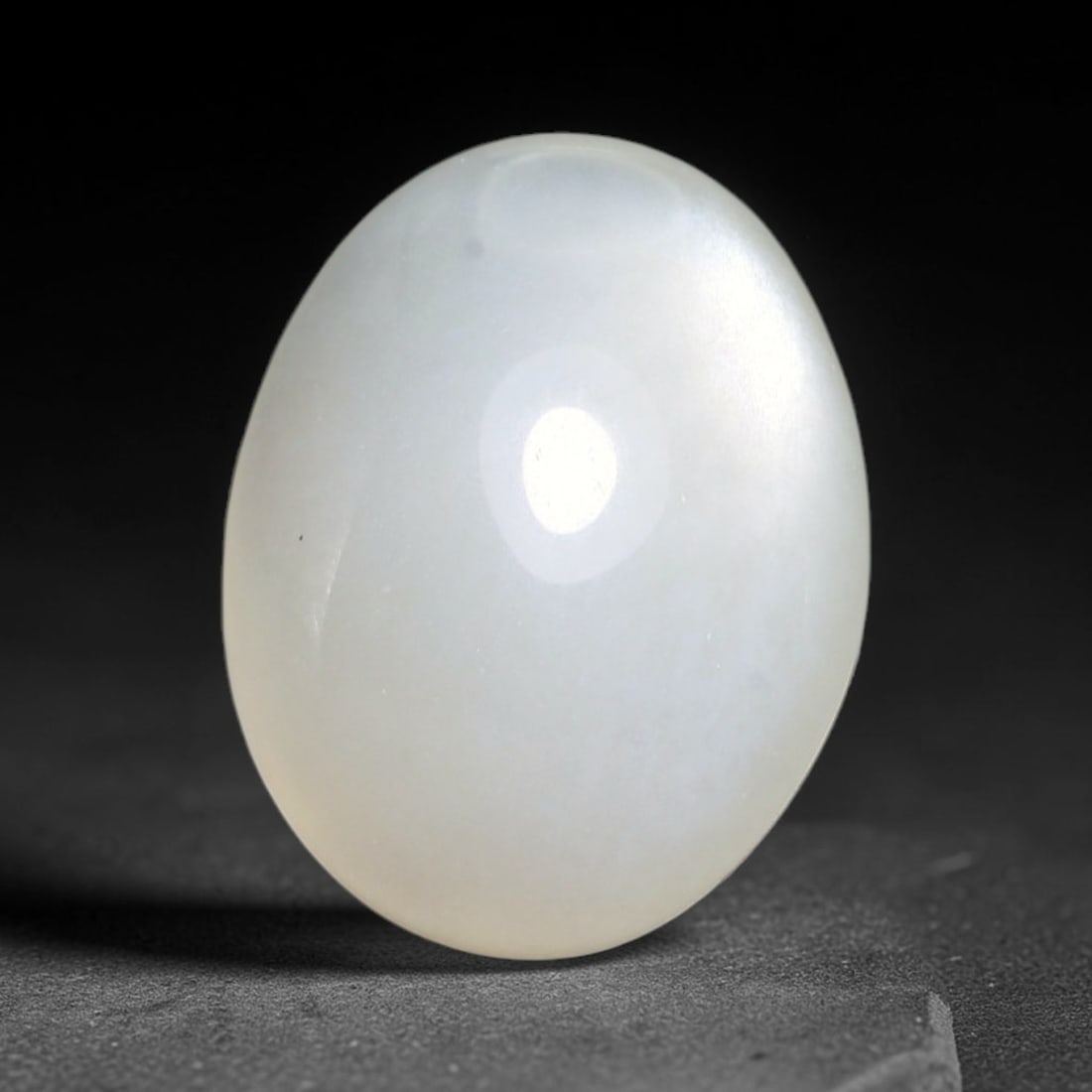 9.30ct Natural Ceylon White Moonstone Cabochon Loose Gemstone, 6FY: This natural Ceylon moonstone cabochon carries a milky white body showcasing classic adularescence. Fine mineral inclusions are visible within the gem. Dimensions measure 15x12x8mm, mined in Sri Lanka