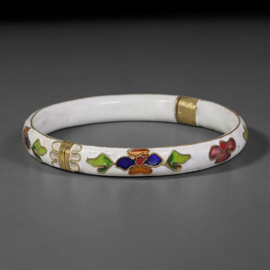 Vintage Chinese Cloisonne Bangle - White Floral Enamel Bracelet, 85FD: Built upon a gilded metal foundation with classic Chinese cloisonne twisted wire filigree craftsmanship, this hinged bangle features an opaque white enamel base adorned with repeating stylized floral 