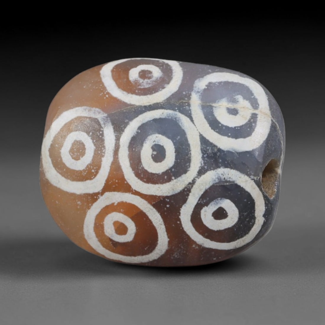 Antique Sino-Himalayan Region Etched Carnelian Bead, 100EG: Antique etched carnelian bead originating from the Sino-Himalayan region. Exhibits characteristic surface patina and traditional etched white decoration. Dimensions: 14x12mm, fully pierced for suspens