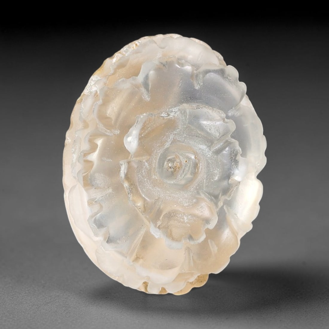 Natural Brazilian Phantom Quartz Hand Carved Floral Gemstone, 97BQ: This hand-carved floral specimen is crafted from natural phantom quartz. Intricate layered floral detailing wraps across the stone's surface, while translucent quartz matrix reveals subtle internal ph