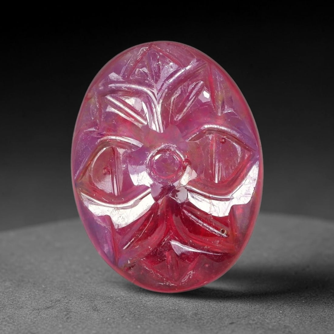 10.98 Carats Natural Mozambique Rich Fuchsia Ruby Loose Gemstone, 37FE: This natural Mozambique ruby cabochon measures 15.8x12.1x4.3mm and features delicate hand engraved floral detailing carved across its polished surface, with a rich saturated fuchsia hue spread evenly 