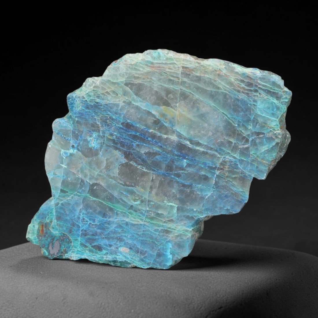 168.82ct Natural Peruvian Chrysocolla Polished Slab Rough, 67EK: This partial-polished chrysocolla slab features blended mineral matrix with smooth refined face and unaltered natural rugged edge across its 54x37x14mm elongated form, translucent mineral layers hold 
