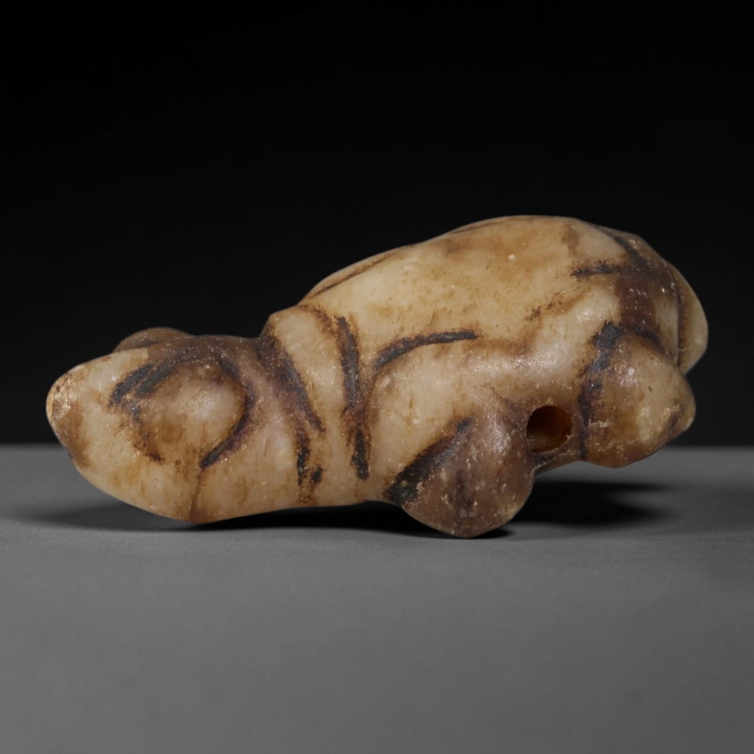 Ancient Western Asiatic Cream Stone Turtle Zoomorphic Amulet (1000-600 BCE), 61AB: Hand-carved pale beige mineral stone talisman sculpted as a stylized recumbent turtle, a symbol of endurance and protective guardianship within Western Asiatic ancient belief traditions. Simple linear