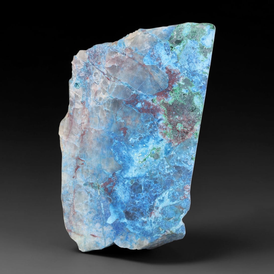 98.64ct Natural Peruvian Chrysocolla Polished Slab Rough, 59EK: This partial-polished chrysocolla slab features blended mineral matrix with smooth refined face and unaltered natural rugged edge across its 46x27x6mm elongated form, translucent mineral layers hold s