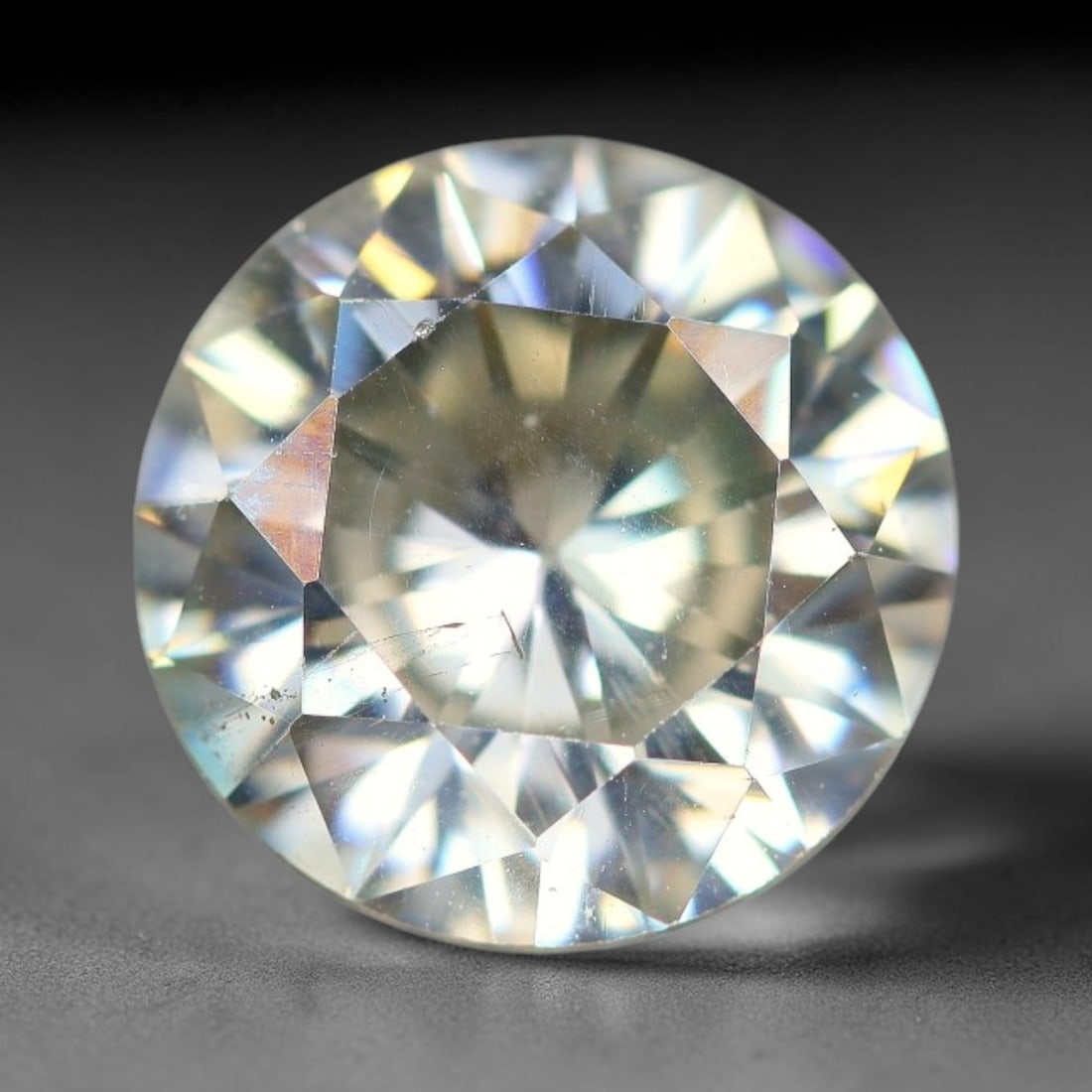 2.06 Carats Natural Cool White Moissanite Loose Gemstone, 19FP: This cool white moissanite holds dimension measurements of 8.4x4.6mm, delivering exceptional light dispersion that generates vivid rainbow sparkle across its fully transparent body, with faint microsc