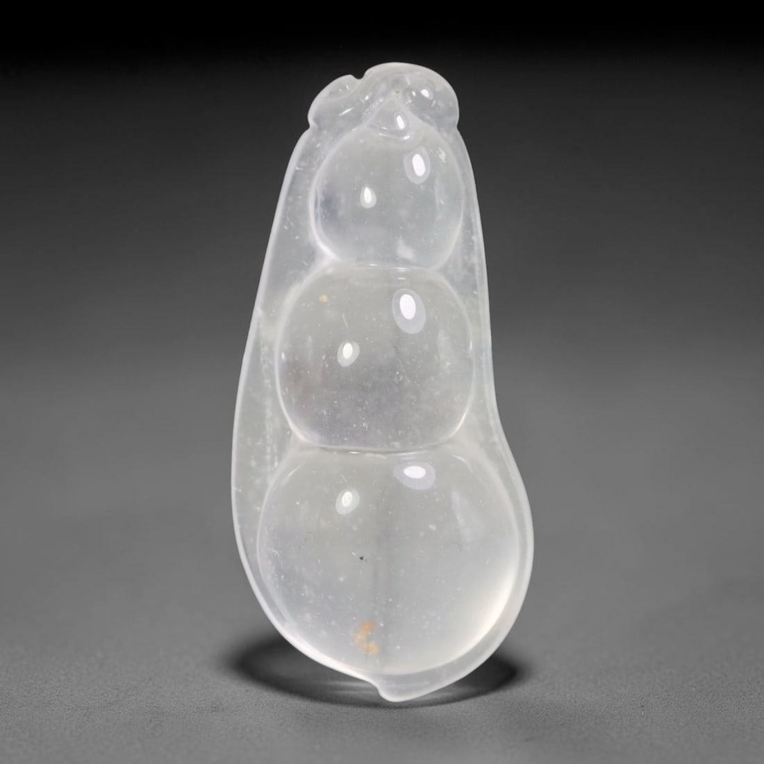Natural Burmese Quartzite Hand Carved Pendant, 18BP: Artisan hand-carved natural Burmese quartzite pendant measuring 55 x 24 mm. Expertly shaped and polished by master craftsmen, showcasing excellent natural crystalline clarity with subtle native minera