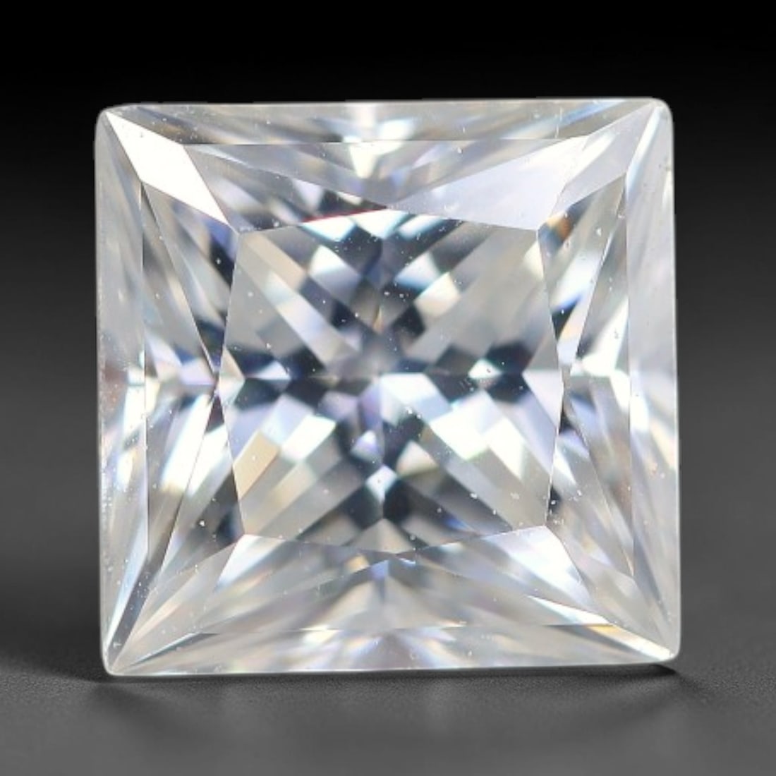 0.91 Carats Natural Clear White Moissanite Loose Gemstone, 21FL: This clear white moissanite features dimension measurements of 5.5x4mm, boasting exceptional light refraction that delivers brilliant crisp sparkle throughout its transparent body, with tiny scattered