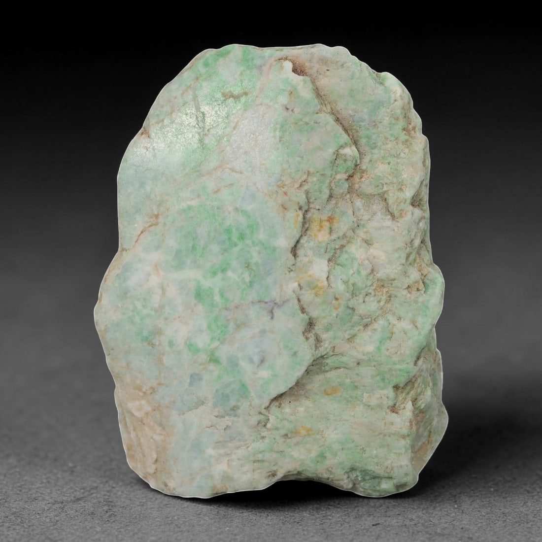 735ct Natural Burmese Moss in Snow Jadeite Rough - Light Green Patterned Stone, 65EA: This is a natural Type A Burmese jadeite rough stone, measuring 6.5x5cm and weighing 147g (735ct). It features the classic "Moss in Snow" pattern, with soft light green patches and streaks naturally s
