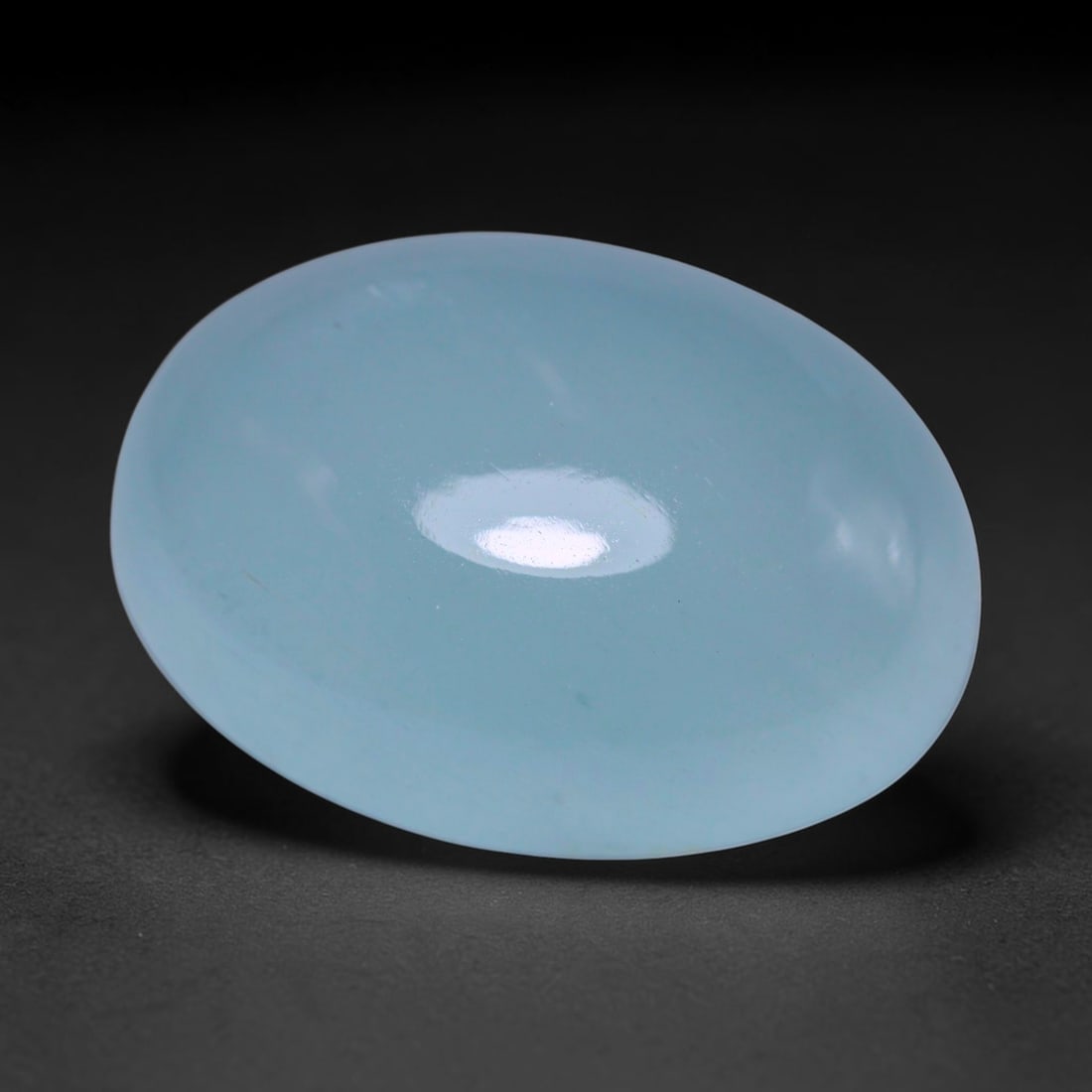 12.66ct Natural Nigerian Aquamarine Oval Cabochon Loose Gemstone, 32BY: This elegantly polished oval cabochon is natural aquamarine sourced from Nigeria. It features soft tranquil pale blue colour with subtle even tone distribution throughout the translucent crystal. The 