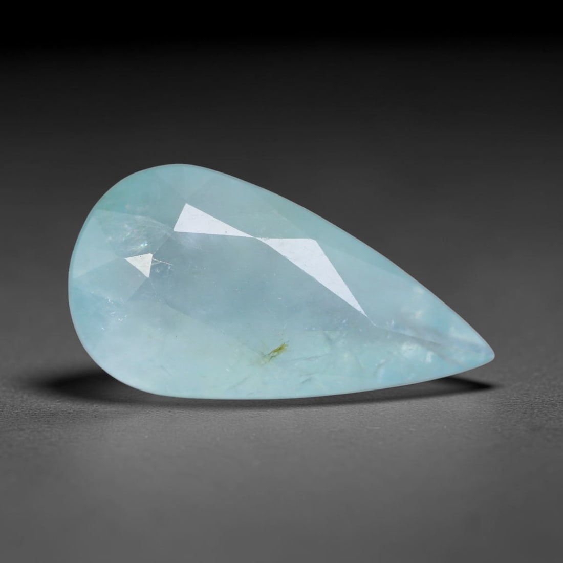 4.32ct Natural Madagascan Faceted Grandidierite Rare Loose Gemstone, 86AS: This expertly faceted finished grandidierite holds soft translucent body tone with fine faint natural internal veining visible beneath precisely cut reflective facets within its 16.8x8.9x5.3mm calibra
