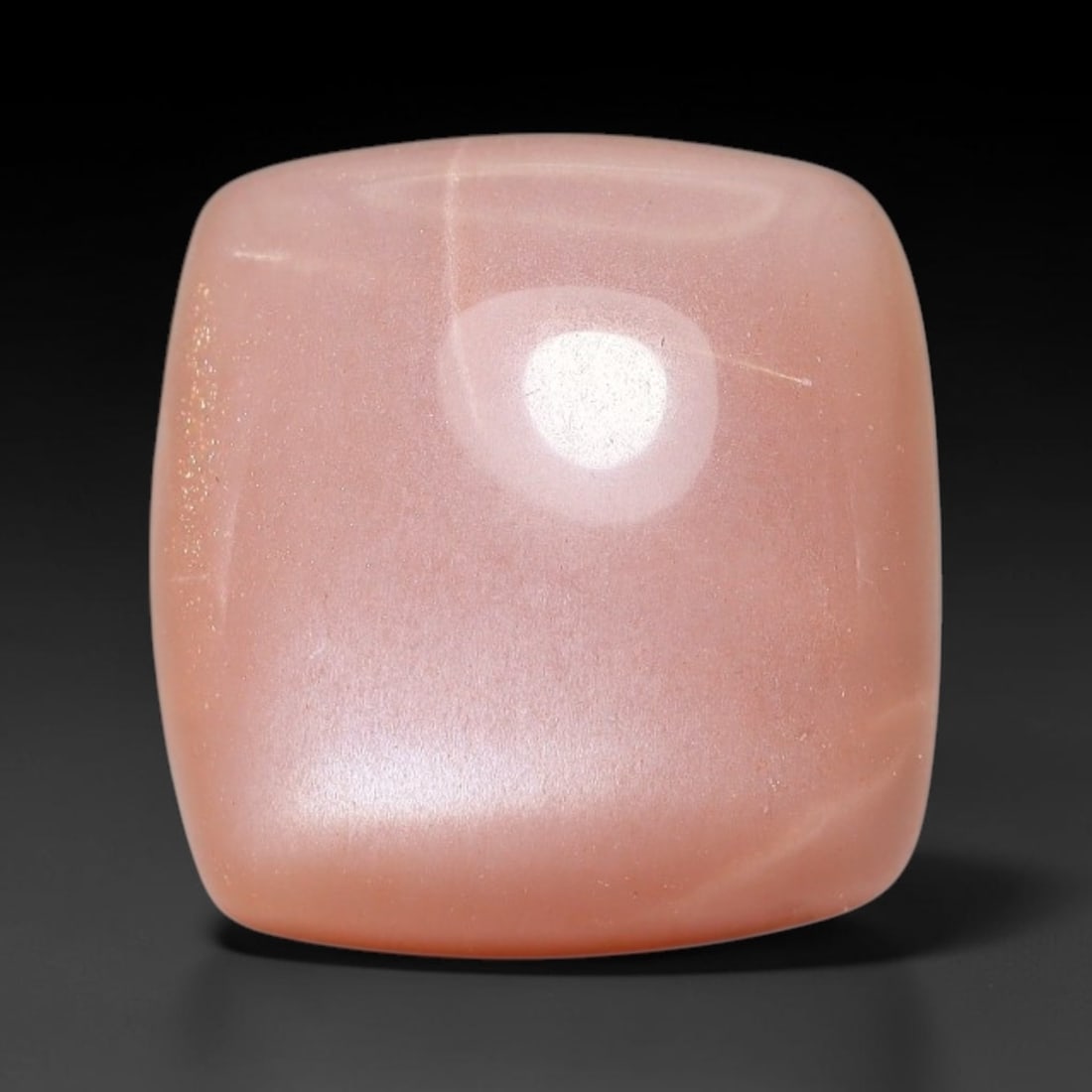 9.41ct Natural Ceylon Warm Peach Moonstone Loose Gemstone, 4FY: This natural Ceylon moonstone has dimension measurements of 13x12x6mm, showcasing a smooth warm peach base tone paired with subtle soft adularescent sheen that glides gently across the polished surfac