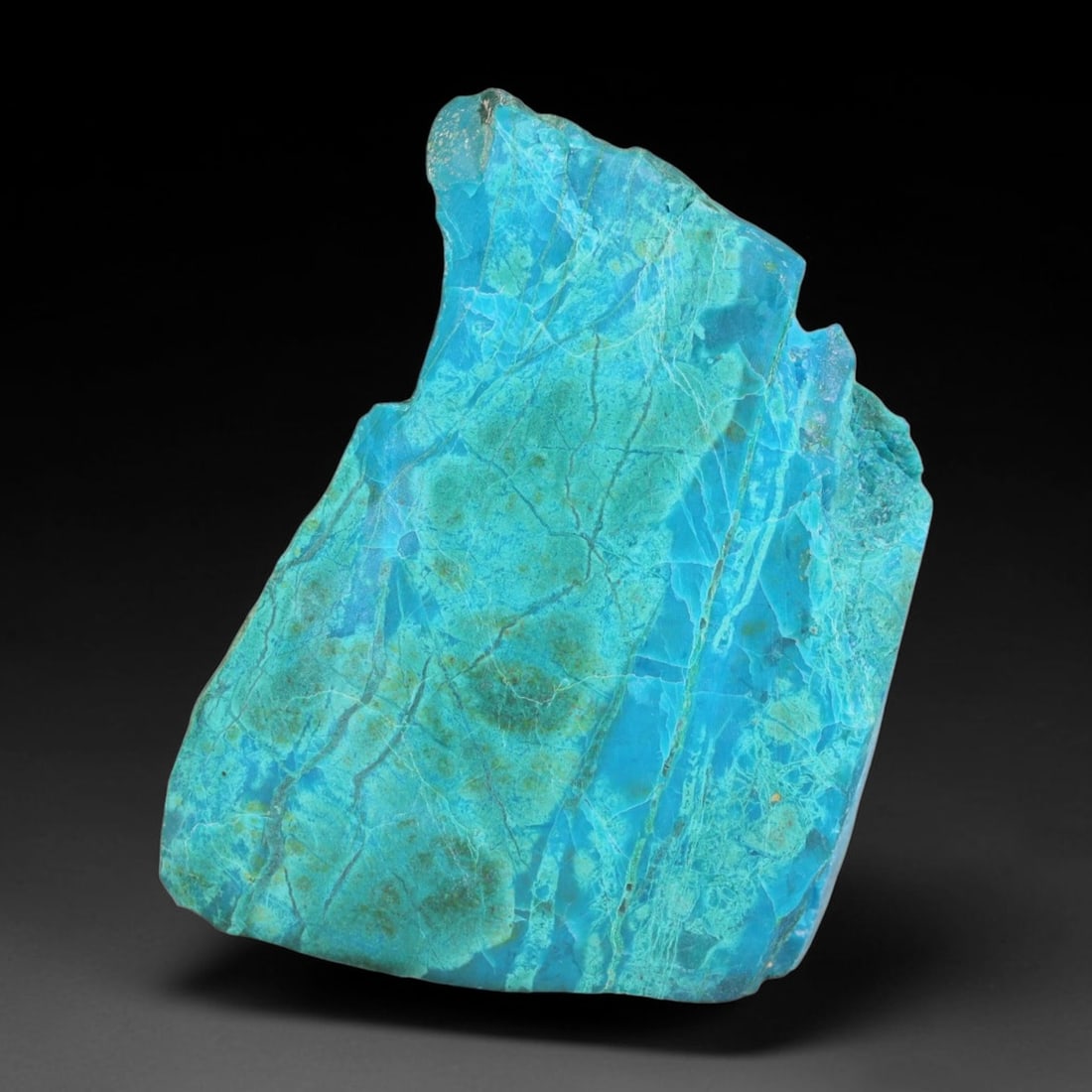 94.58ct Natural Peruvian Chrysocolla Polished Slab Rough, 58EK: This partial-polished chrysocolla slab features blended mineral matrix with smooth refined face and unaltered natural rugged edge across its 37x28x10mm elongated form, translucent mineral layers hold 