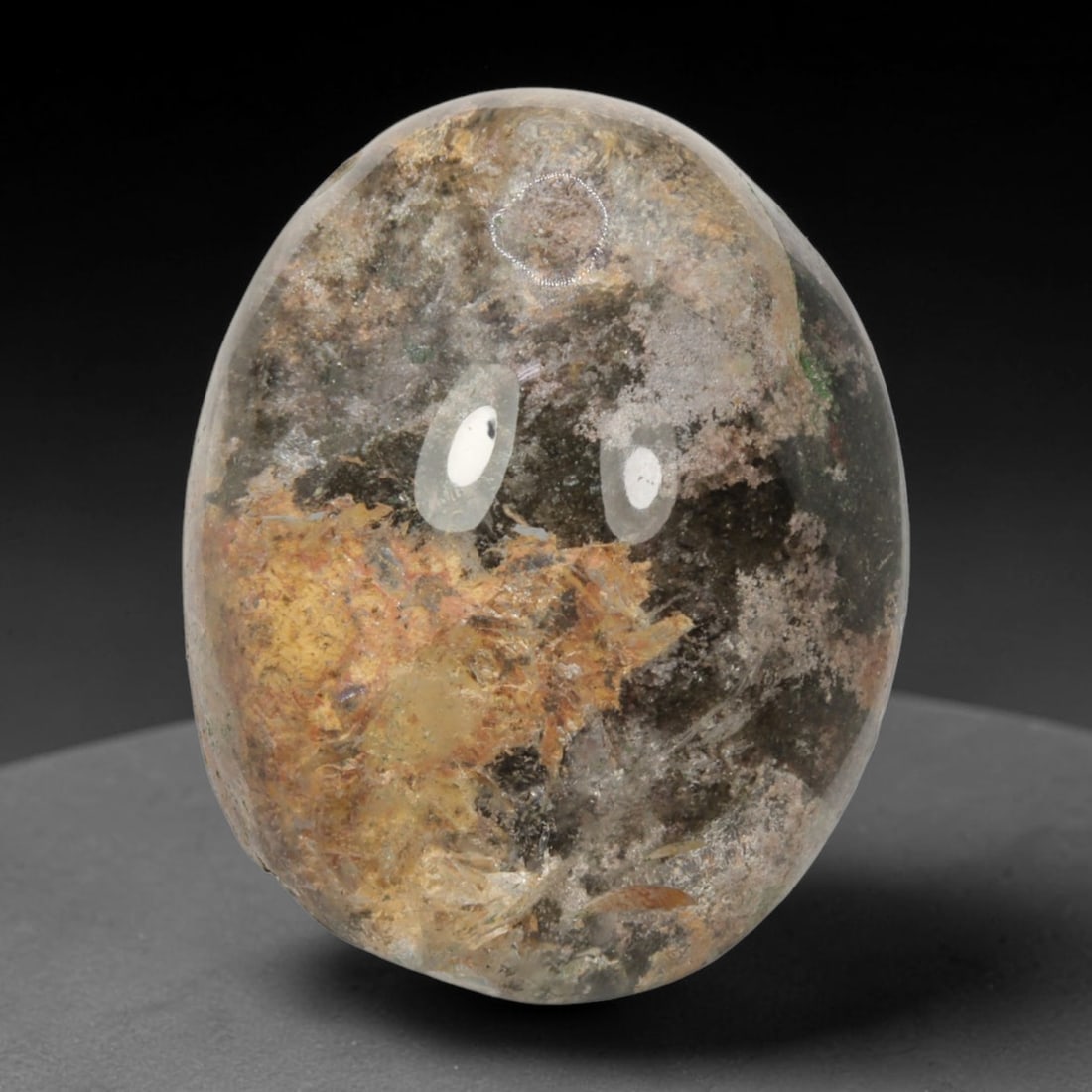 32ct Natural Brazilian Phantom Quartz Oval Cabochon Loose Gemstone, 16BM: This smoothly polished cabochon of natural phantom quartz preserves delicate layered phantom crystal formations enclosed inside transparent quartz host. The domed polished surface offers unobstructed 