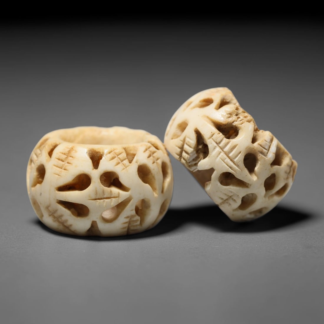 Antique Sino-Siberian Steppe Nomadic Craft Stag Antler Carved Bead Pair (Post 1850s), 45FV: Pair of beads skillfully carved from natural stag antler, originating from Sino-Siberian Steppe Nomadic craft traditions, produced post 1850s. The antler material holds attractive natural aged patina,