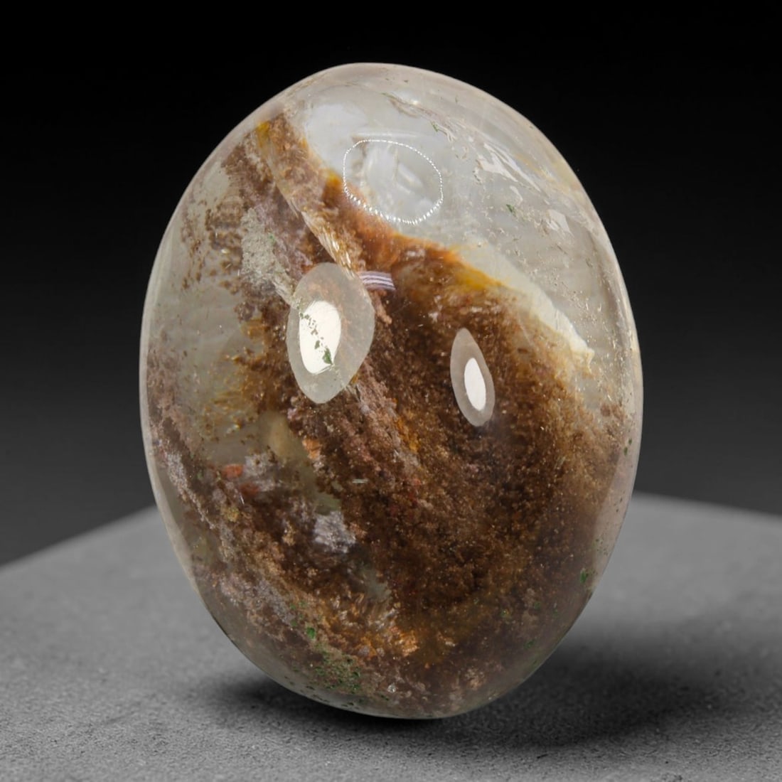 27ct Natural Brazilian Phantom Quartz Oval Cabochon Loose Gemstone, 88BL: This smoothly polished cabochon of natural phantom quartz preserves delicate layered phantom crystal formations enclosed inside transparent quartz host. The domed polished surface offers unobstructed 