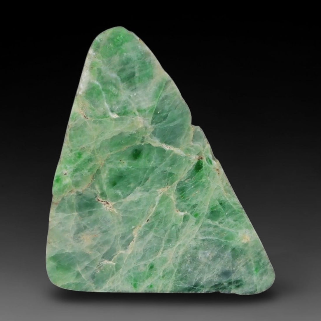 146ct Natural Type A Burmese Jadeite Jade Sliced Rough, 1AZ: This specimen is a sliced rough block of natural Type A Burmese jadeite jade. The interior displays natural colour zoning with visible mineral veining and crystalline patterns typical of unprocessed j