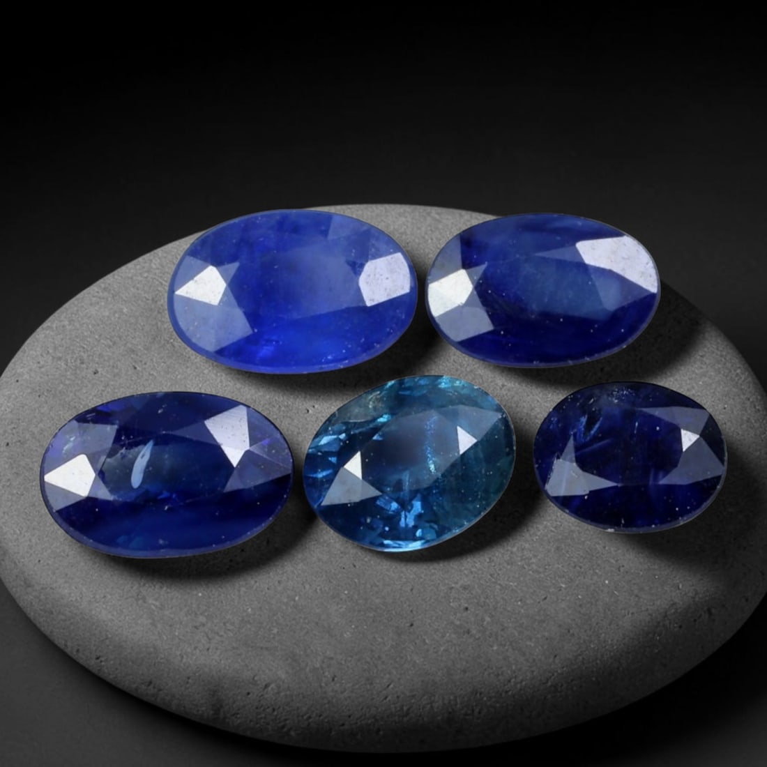 2.03ct Natural Australian Blue Sapphire Loose Gemstone Parcel, 90BV: This parcel consists of natural blue sapphire originating from Australia. The stones display varied cool blue tonal variation across the crystal material, polished with fine faceting to maximise light