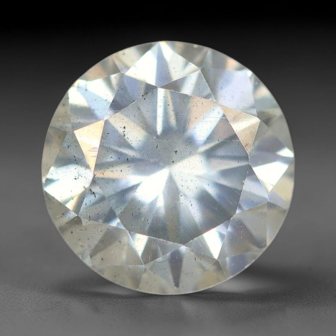 1.67 Carats Natural Cool White Moissanite Loose Gemstone, 16FP: This cool white moissanite holds dimension measurements of 7.6x4.7mm, delivering exceptional light dispersion that generates vivid rainbow sparkle across its fully transparent body, with faint microsc