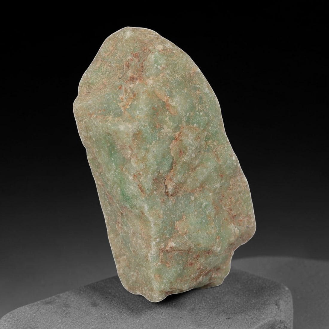 190ct Natural Burmese Light Green Jadeite Jade Rough Stone, 83EA: This is a natural Type A Burmese jadeite jade rough stone, measuring 4.7x2cm and weighing 38g (190ct). It features a soft light green body partially covered by a natural weathered outer skin with redd
