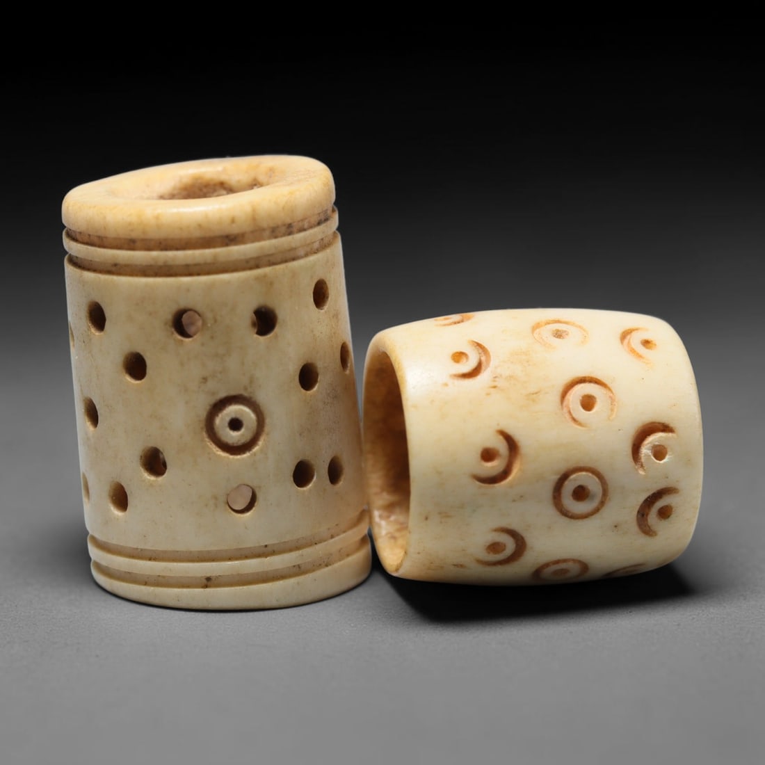 Antique Sino-Siberian Steppe Nomadic Craft Stag Antler Carved Bead Pair (Post 1850s), 50FV: Pair of beads skillfully carved from natural stag antler, originating from Sino-Siberian Steppe Nomadic craft traditions, produced post 1850s. The antler material holds attractive natural aged patina,