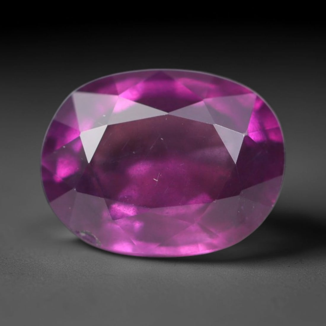 1.83ct Natural Tanzanian Rhodolite Grape Garnet Faceted Loose Gemstone, 94BA: This expertly faceted grape garnet, a scarce saturated purple-magenta rhodolite variant, features transparent crystal structure dotted with faint microscopic mineral specks within its precisely cut re