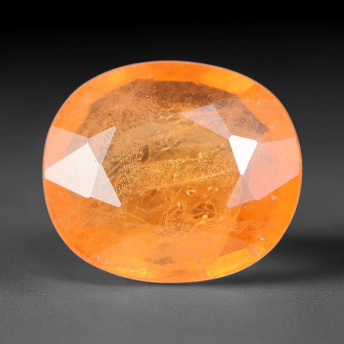 1.15ct Natural Sri Lankan Padparadscha Sapphire Loose Gemstone, 60BC: This fully polished Padparadscha sapphire carries warm blended peach-pink and soft orange body saturation, with subtle microscopic mineral flecks dispersed within its crystalline interior across its c