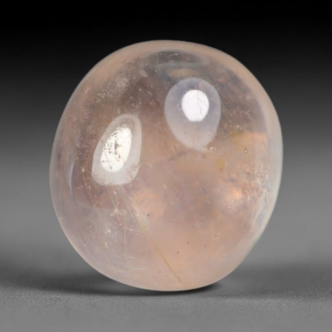 2.15ct Natural Sri Lankan Padparadscha Sapphire Loose Gemstone, 61BA: This fully polished Padparadscha sapphire features soft warm peach-orange blended body tone, with faint natural mineral traces scattered throughout its crystalline interior, measured at calibrated dim