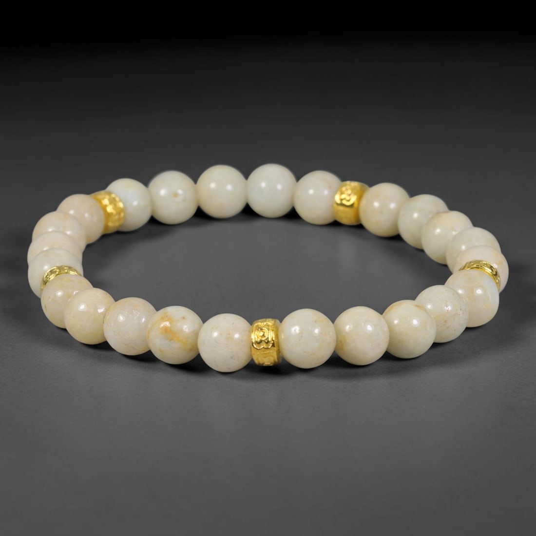 Natural Burmese Type A Jadeite Jade Bead Bracelet, 47EK: Smooth spherical beads of natural Burmese Type A jadeite jade accented with decorative metallic spacer beads. Bead size measures 8.3mm. Polished finish creates a wearable strand ideal for personal wea