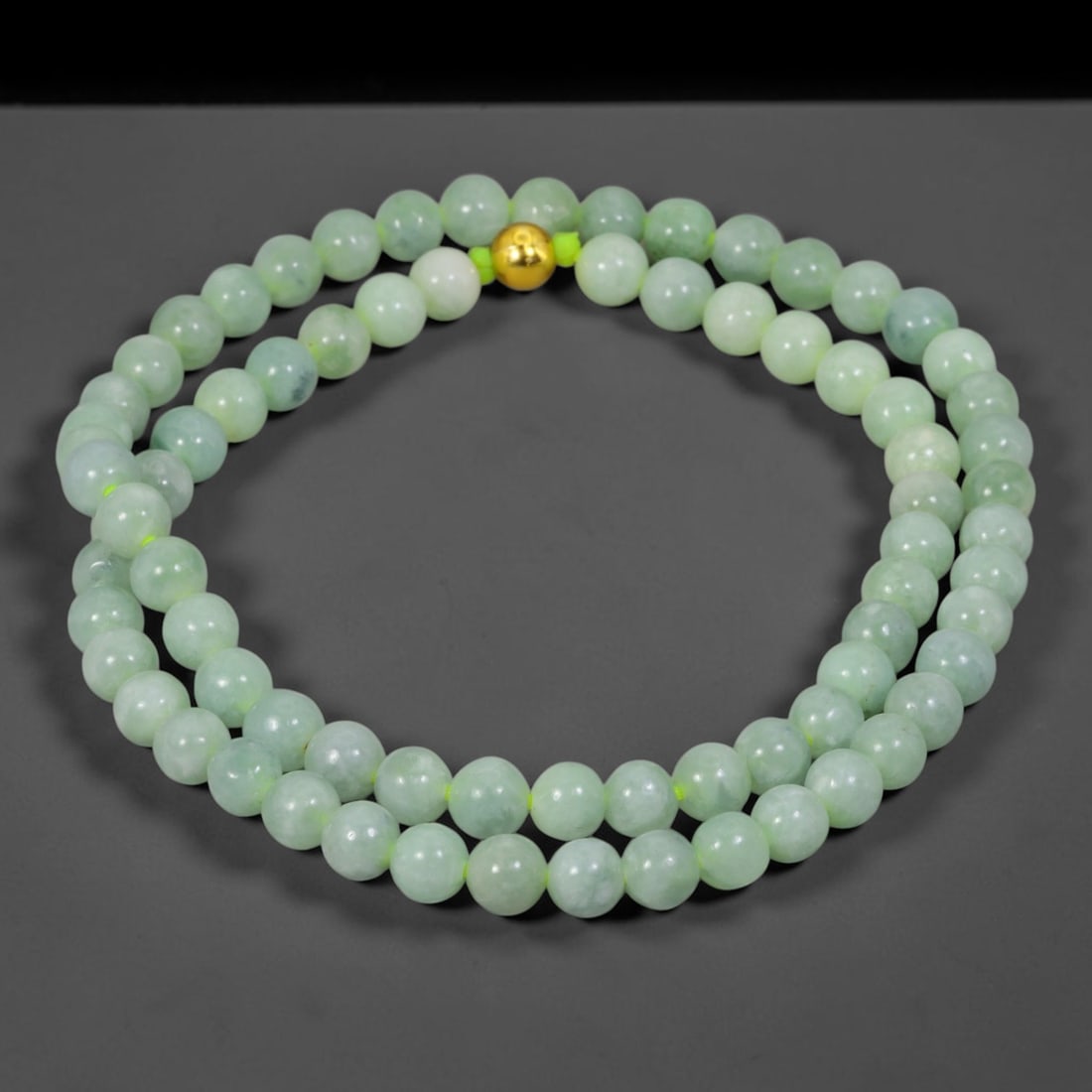 Natural Burmese Type A Jadeite Jade Round Bead Necklace with Gold Gilt Accent Bead, 3BL: Elegant hand-strung necklace made from polished natural untreated Burmese Type A jadeite jade spherical beads, each bead measuring 8 mm in diameter. The jadeite features a soft pale milky celadon hue 