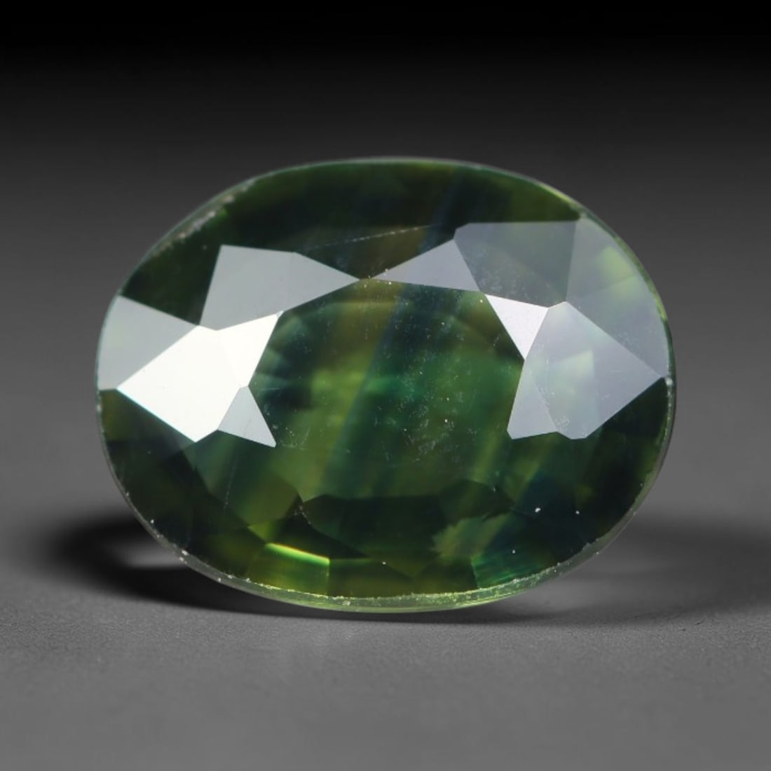 1.14ct Natural Australian Parti Sapphire Faceted Loose Gemstone, 74BA: This expertly faceted Australian parti sapphire features blended multi-tonal green-yellow internal saturation with tiny scattered microscopic mineral specks suspended within its transparent crystallin